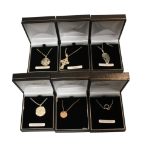 COLLECTION OF SIX ASSORTED PENDANTS ON CHAINS
