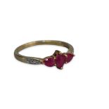 9 CT GOLD THREE STONE RUBY RING