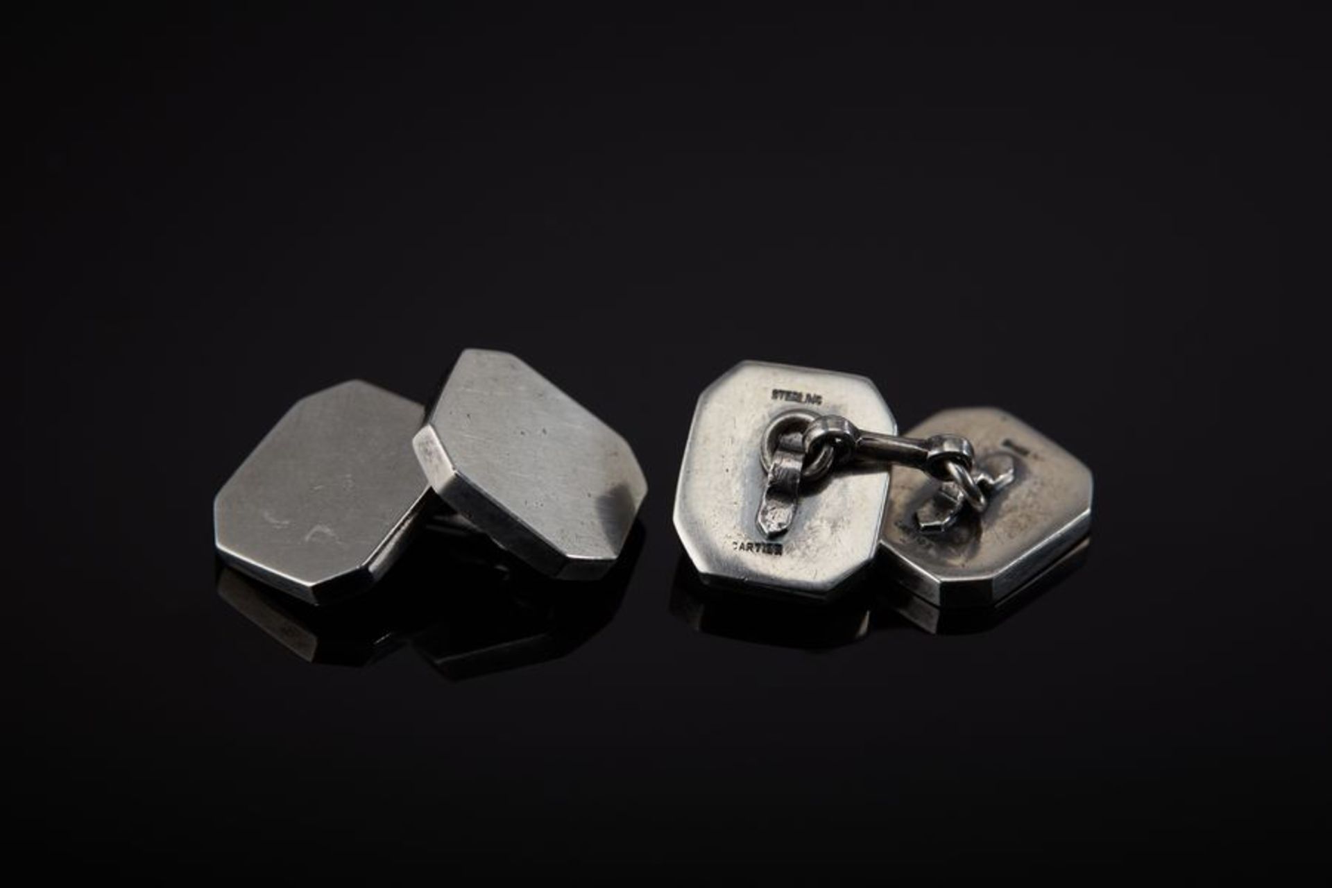 A Pair of Silver Cufflinks - Signed Cartier Sterling (NY), in a Cartier pouch [...]