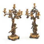 Paire de candélabres en bronze à six lumières représentant un couple faunes [...]