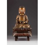 SITZENDER SHAKYAMUNI China, Ming-Dynastie Bronze, part. vergoldet. Ges.-H. 52 cm, H. 33,5 cm (