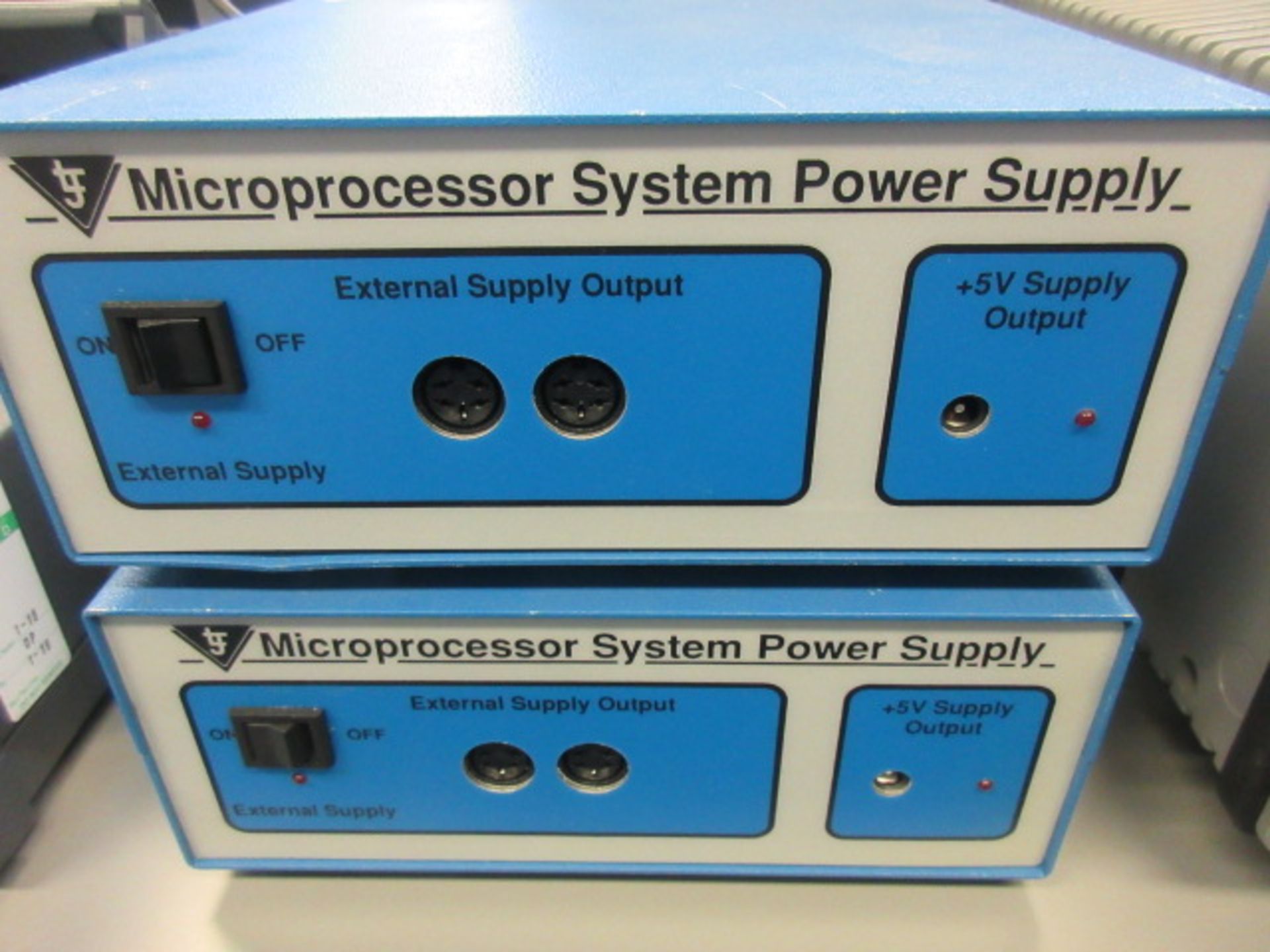 TWO MICROPROCESSOR SYSTEM POWER SUPPLYS