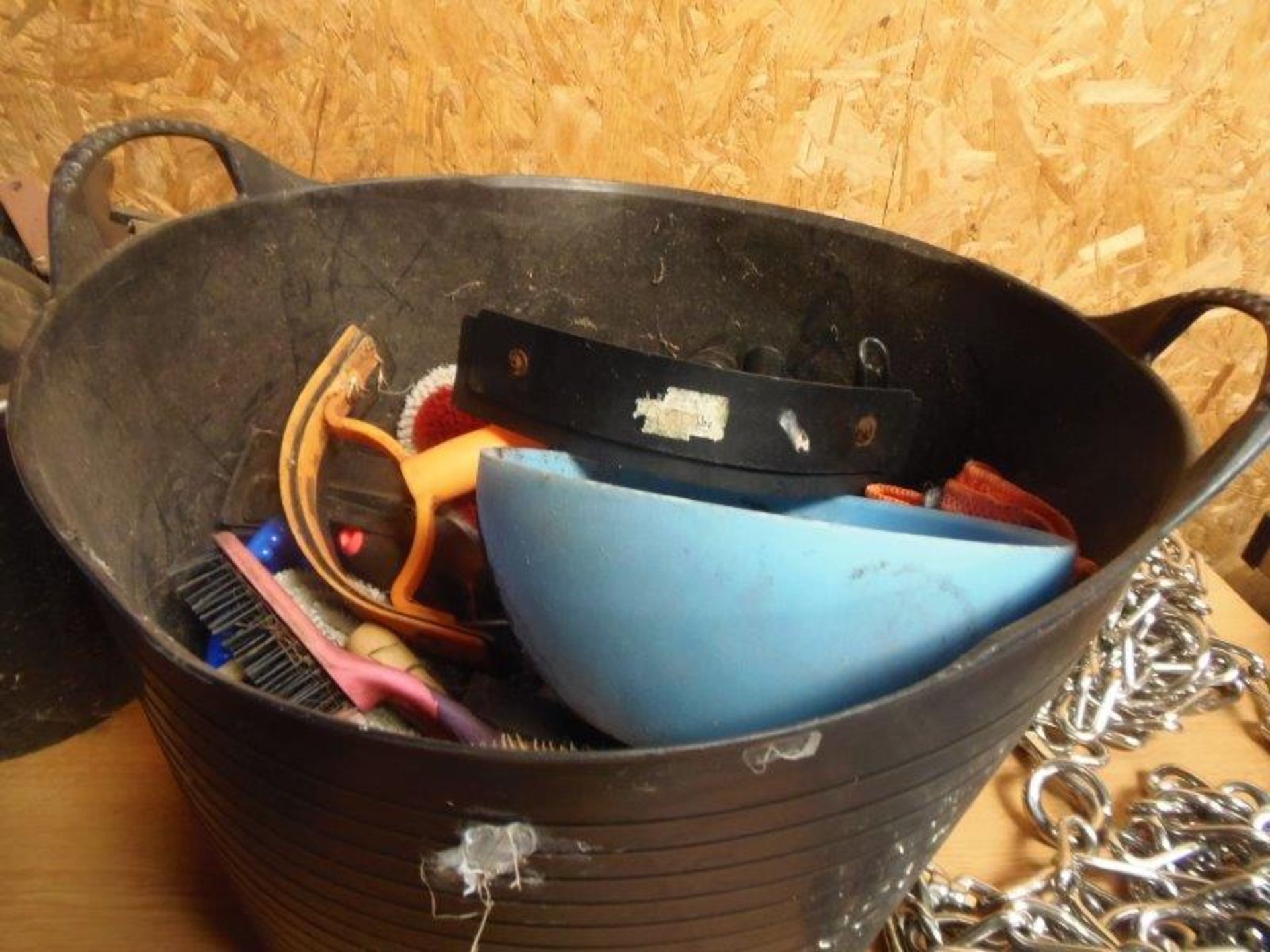 Bucket of miscellaneous grooming tools