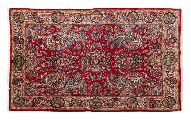 Tapis Sarough. Iran. 3ème quart du XXe s.. à médaillon central flanqué de botehs sur fond rouge fleu