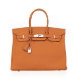 Hermès. sac Birkin 35 en cuir Togo orange Potiron. tirette et clochette avec 2 clefs et cadenas. hou