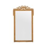 Miroir rectangulaire d'époque Napoléon III. en bois et stuc doré. à décor d'un ruban noué. d'une fri