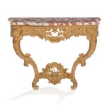 Console de style Louis XV. XIXe s.. en bois sculpté et doré à décor de coquilles ajourées. guirlande