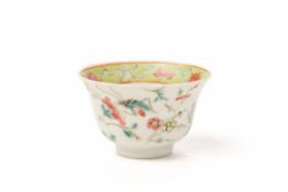 A CHINESE PORCELAIN BOWL DECORATED WITH FLOWERS AND INSECTS