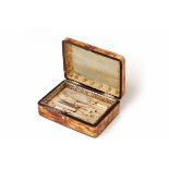 A 19TH CENTURY FRENCH TORTOISE SHELL BOX CONTAINING A MOTHER-OF-PEARL SEWING KIT