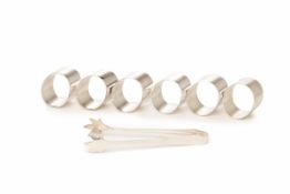 SIX STERLING SILVER NAPKIN RINGS, WITH A TONG