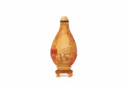 A CARVED HORNBILL SNUFF BOTTLE, WITH ITS STAND
