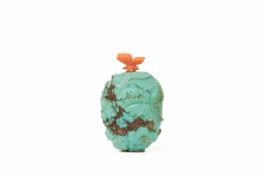 A CARVED TURQUOISE SNUFF BOTTLE WITH CORAL BUTTERFLY STOPPER