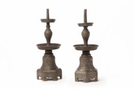 A PAIR OF ANTIQUE CHINESE PEWTER CANDLESTICKS