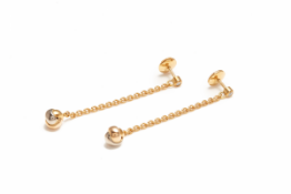 CARTIER - A PAIR OF GOLD BABY TRINITY EARRINGS