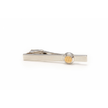 DUNHILL - A COIN-SHAPED BRUSHED SILVER TIE BAR