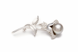 A WHITE GOLD, PEARL AND DIAMOND FLORAL BROOCH
