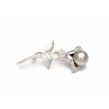 A WHITE GOLD, PEARL AND DIAMOND FLORAL BROOCH