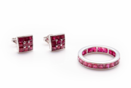 AN 18K WHITE GOLD AND RUBY ETERNITY RING AND EARRINGS