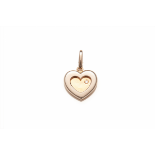 CARTIER - A RARE 18K GOLD AND DIAMOND HEART SHAPED CHARM PENDANT