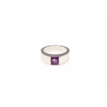 CARTIER - AN 18K WHITE GOLD AND AMETHYST 'TANK' RING