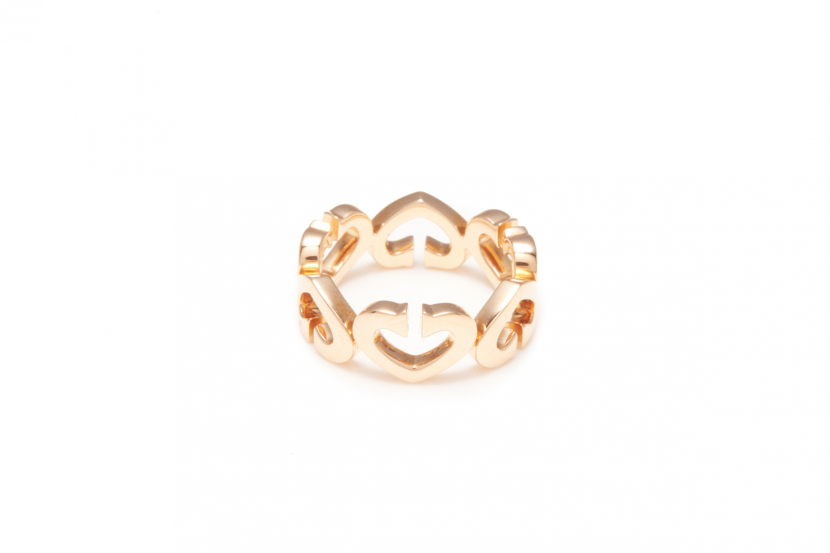 CARTIER - AN 18K ROSE GOLD AND DIAMOND 'HEART & SYMBOLS' RING