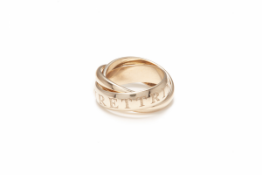 CARTIER - A LIMITED EDITION 18K 'OR AMOUR ET TRINITY' RING