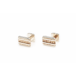 TIFFANY & CO - A PAIR OF SILVER 'ATLAS' ROMAN NUMERAL CUFFLINKS