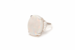 A PLATINUM, OPAL AND DIAMOND RING