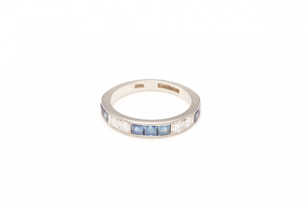 AN 18K WHITE GOLD, DIAMOND AND SAPPHIRE HALF ETERNITY RING