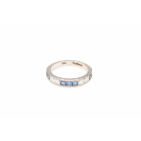 AN 18K WHITE GOLD, DIAMOND AND SAPPHIRE HALF ETERNITY RING
