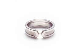 CARTIER - A 18K WHITE GOLD ‘C’ RING