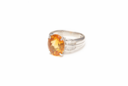 A PLATINUM, CITRINE AND DIAMOND RING