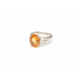 A PLATINUM, CITRINE AND DIAMOND RING