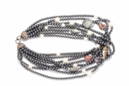 MATTHEW CAMPBELL LAURENZA - A MULTI-STRAND SAPPHIRE NECKLACE SET WITH SILVER SHELLS