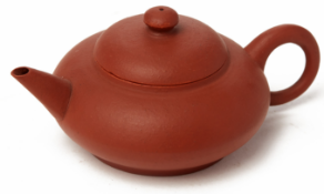 A SMALL COMPRESSED CIRCULAR YIXING POTTERY TEAPOT