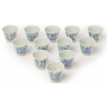 A SET OF TWELVE WUCAI PORCELAIN WINE CUPS