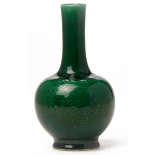 A SMALL GREEN GLAZED PORCELAIN BOTTLE VASE