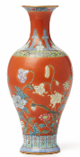 A 'FAMILLE ROSE' CORAL-RED GROUND BALUSTER VASE