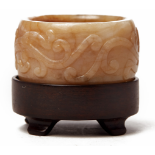 A CARVED RUSSET JADE ARCHER'S RING