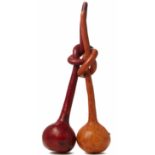 TWO INTERTWINED KNOTTED AND VARNISHED GOURDS