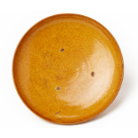 AN AMBER GLAZED SHALLOW DISH