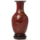 A RED FLAMBÉ GLAZED BALUSTER VASE