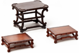 A GROUP OF THREE HARDWOOD STANDS