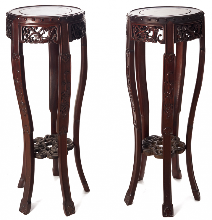 A PAIR OF CIRCULAR BLACKWOOD STANDS