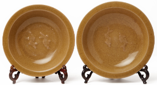 A NEAR PAIR OF 'GOLDEN' LONGQUAN CELADON TWIN FISH DISHES