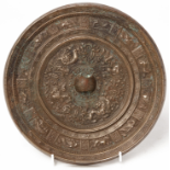 A LARGE SILVERY BRONZE INSCRIBED ZODIAC MIRROR