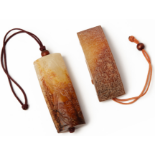 AN ARCHAISTIC CARVED JADE SWORD SLIDE AND A PENDANT