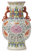 A DOUCAI TWIN HANDLED LOTUS AND BAT VASE