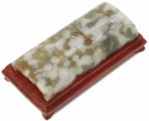 A MOTTLED JADE BAMBOO FORM WRIST REST