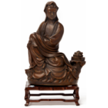 A BRONZE FIGURE OF A SEATED GUANYIN